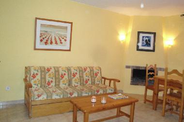 living room with sofabed and chimeney