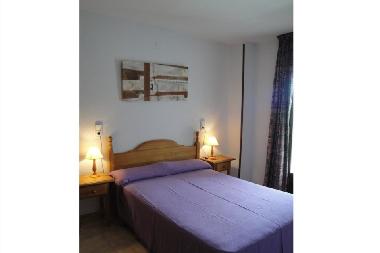 bedroom with big bed and terrace