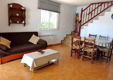 dining and living room with double sofabed left house