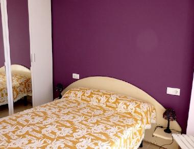 bedroom in suite with double bed, bathroom with shower 