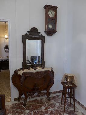 hall with antique furniture of 18th century, bronze ornaments, bronze vases