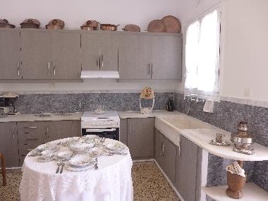 kitchen with copper utensils along with porcelain