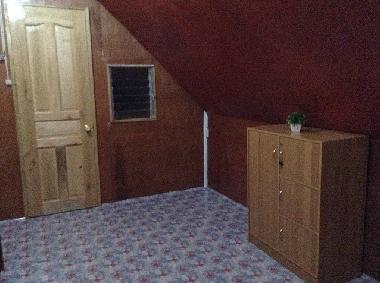 Bedromm at the second floor with cabinet and Balcony door