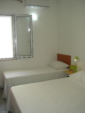 double room - with 2 single bed on the sides - basement
