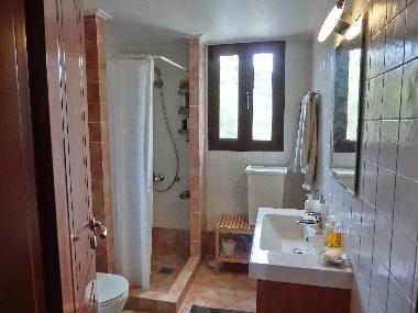 family size bathroom with washer