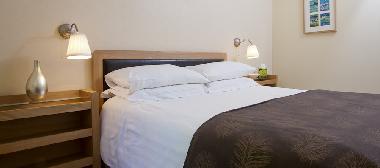 King size bedroom with views into the garden