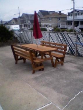 1 of 2 Picnic Tables with New Huge Umbrella by the Pool