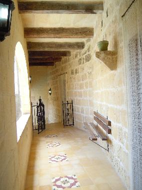 BALLUTA holiday house other side of first floor bedrooms patio with bench