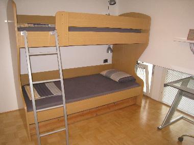 A room in the first floor, bunk bed with a smaller pull out bed