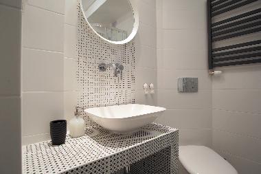 Bathroom with shower and washing machine