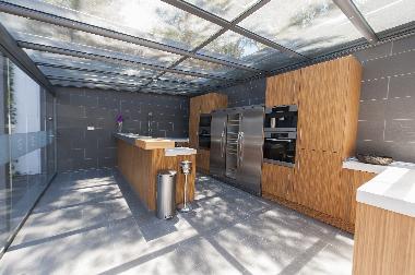 Downstairs outdoor kitchen with all modern appliances
