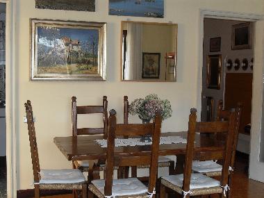 Large bright living room with large window overlooking the lake.