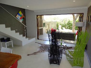BushGlam open plan lounge dining area opening onto the garden