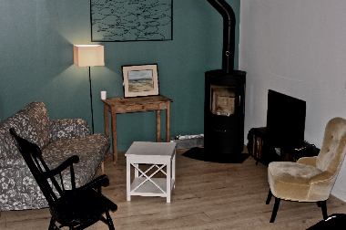 living area with stove and television
