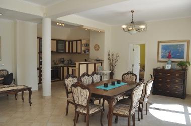 Open plan kitchen with dining table