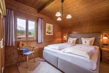 Sleeping room Chalet Seerose in our hotelgarden
